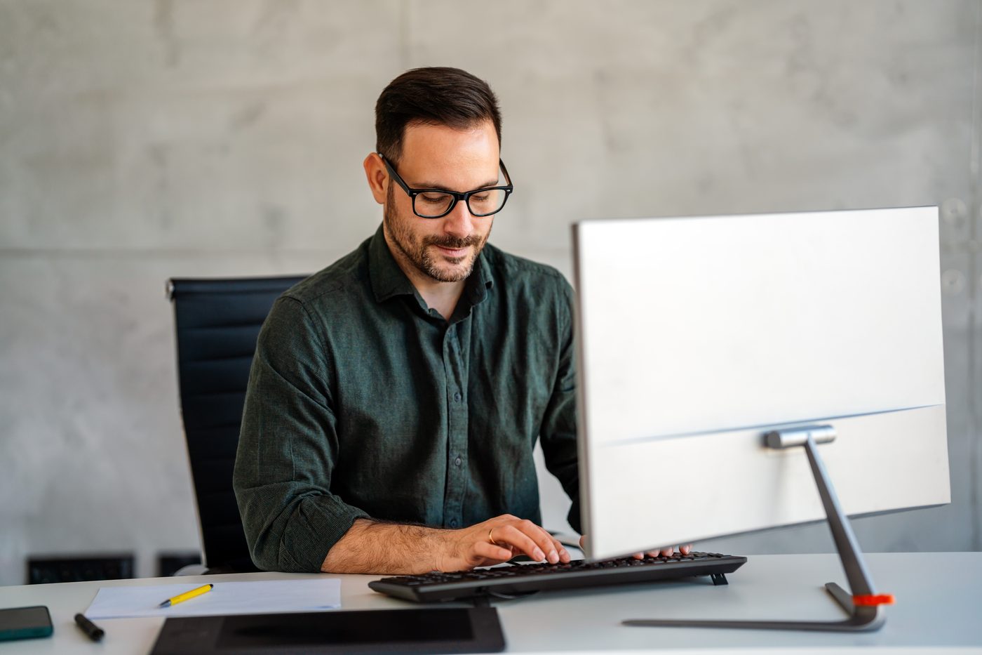 Creative professional working at a computer in a modern office